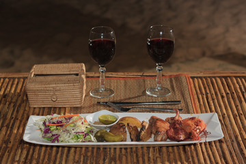 Seafood mix barbecue with salad on plate on bamboo table