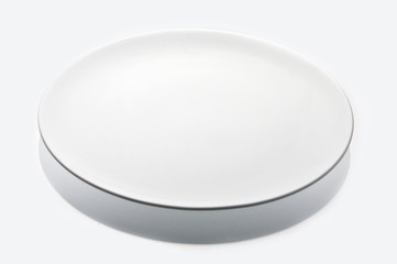 White ceramic plate studio isolated