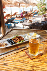 Squid tempura snack on plate on bamboo table