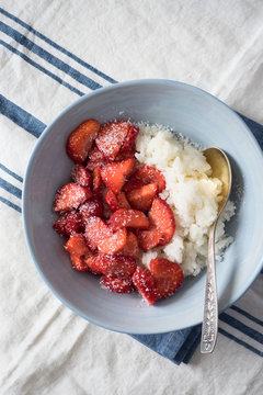 Rice Porridge Served with Strawberries and Dried Coconut