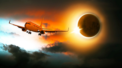 Fototapeta na wymiar Sonnenfinsternis, Passagierflugzeug am Himmel