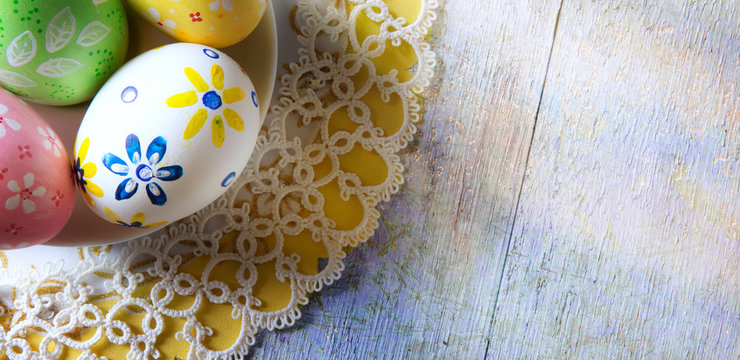 art Easter eggs on wooden table background