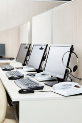 Computers With Headphones At Office