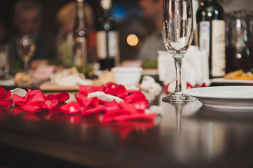 Petals of roses on a table 2100.