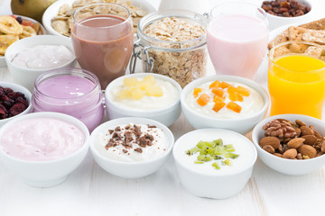 Assorted fruit yoghurts and breakfast ingredients