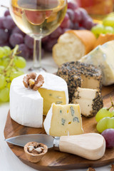 cheese platter, snacks, bread and wine, vertical, close-up