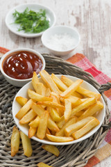 fried french fries with tomato sauce, vertical