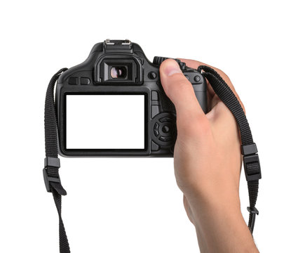 DSLR camera in hand isolated