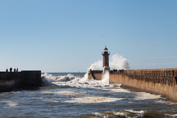 Waves on brekwater in Porto, Portugal.