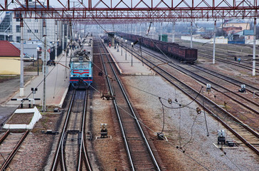 Fototapeta na wymiar Passenger train standing on the station platform
