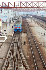 Fototapeta na wymiar Passenger train standing on the station platform,