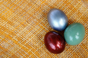 Colorful easter eggs on bamboo weave sheet background, Easter de