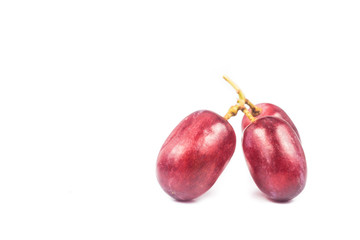 Close up of three pieces of red grape