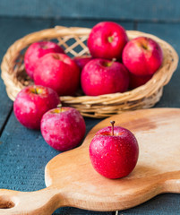 fresh red apples on a wooden board, fruits