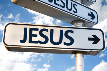 Jesus direction sign on sky background