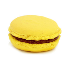 close up of colorful macarons over white background