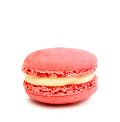 close up of colorful macarons over white background