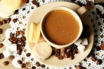 Gentle colorful macaroons and  coffee in mug
