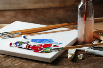 Professional art materials on wooden background