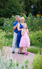 Fototapeta premium Happy family on the nature on a green grass