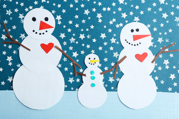 Handmade snowmen on bright background