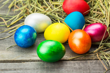 Colorful easter eggs in brown basket