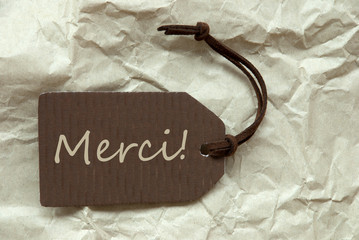 Brown Label With French Merci Means Thank You Background