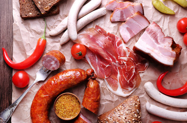 Assortment of deli meats on parchment, closeup