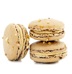 close up of colorful macaroons over white background