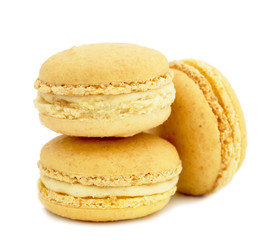 close up of colorful macaroons over white background