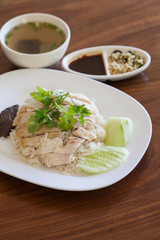 Hainanese Chicken Rice on wood table