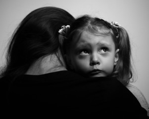 Close between loving mother and daughter looking with hope