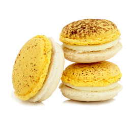 close up of colorful macaroons over white background