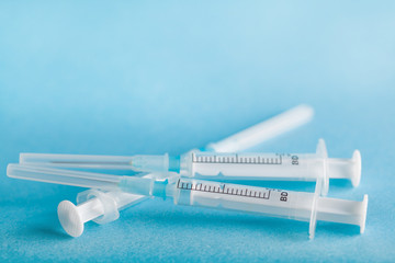 three disposable syringe close-up