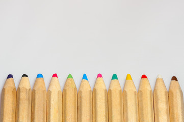 colored wood pencils aligned