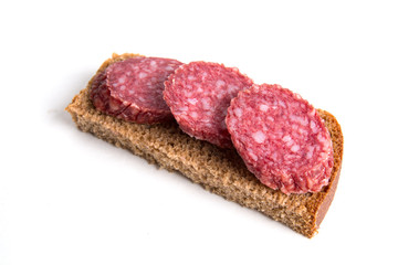 Sliced sausage on a white background