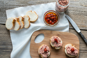 Sandwiches with pate on the wooden board