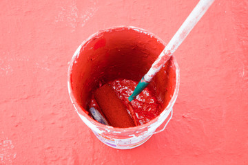 paint roller in a bucket