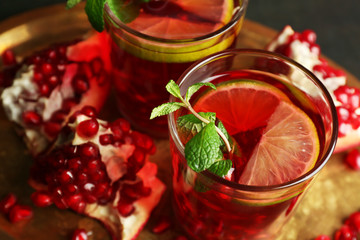 Pomegranate drink in glasses with mint
