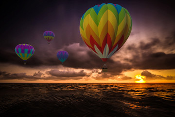 Fototapeta na wymiar Colorful Hot Air Balloons over sea