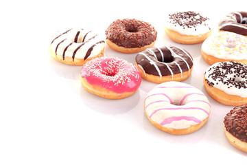 Delicious donuts with icing isolated on white