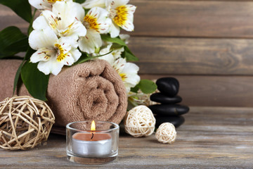Beautiful spa composition with candle and flowers