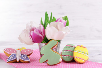 Delicious Easter cookies on table on light background