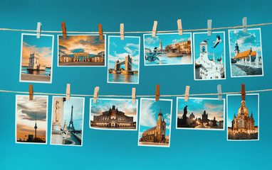 Fototapeta Pictures of european landmarks pinned on ropes, toned image obraz