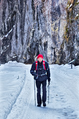 Hiker on snowy road