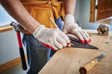 carpenter making a measurement