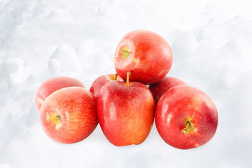 fresh apple fruit in snow  background