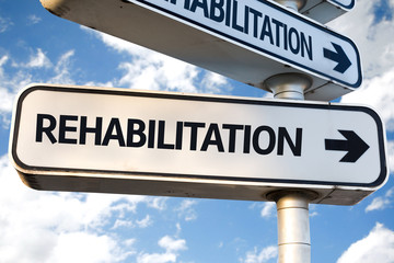 Rehabilitation direction sign on sky background