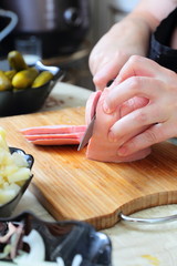 Preparing russian traditional salad Olivier