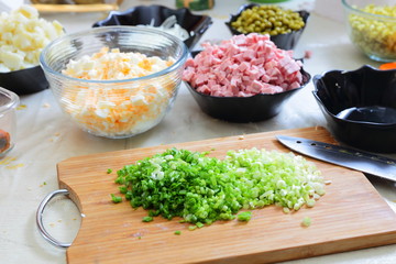 Preparing russian traditional salad Olivier